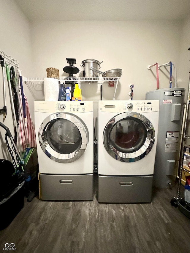 4209 Switchgrass Way, Indianapolis, IN 46237 - laundry area featuring electric water heater, dark wood-style floors, and washer and dryer