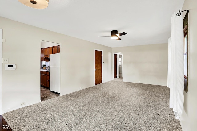 1868 N Hawthorne Ln, Indianapolis, IN 46218 - unfurnished room with dark carpet and ceiling fan