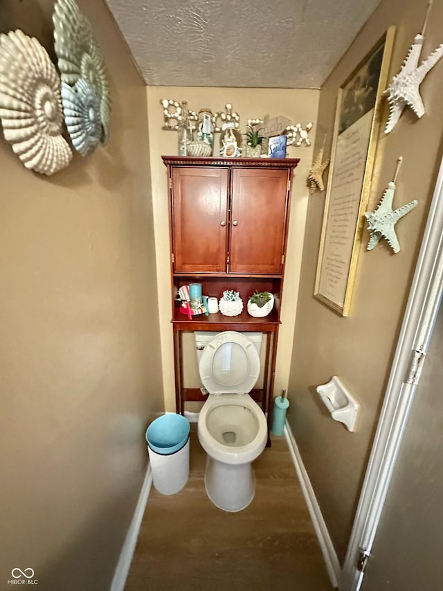 1831 Beckenbauer Ln, Indianapolis, IN 46214 - bathroom with baseboards, toilet, and a textured ceiling