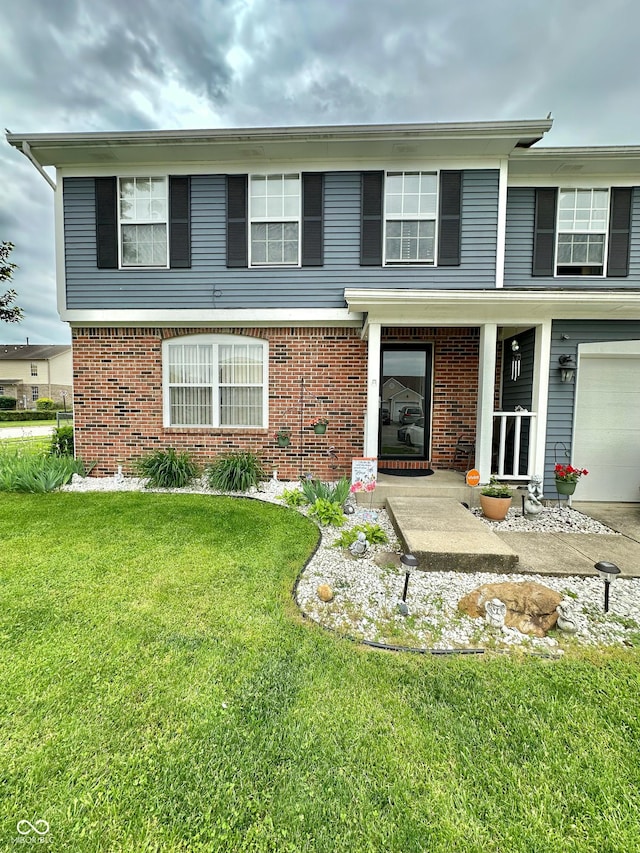 1831 Beckenbauer Ln, Indianapolis, IN 46214 - view of front of home featuring a front lawn, brick siding, a garage, and covered porch