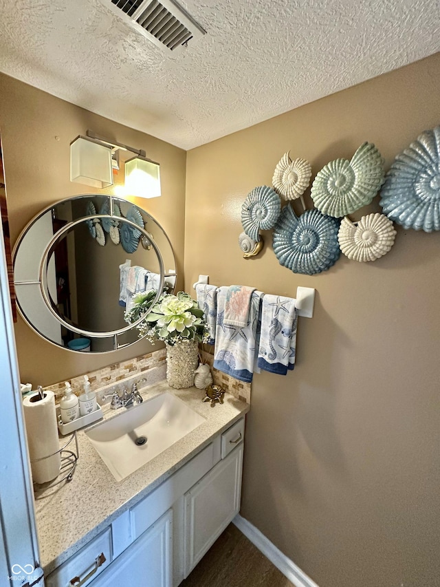 1831 Beckenbauer Ln, Indianapolis, IN 46214 - bathroom with a textured ceiling and vanity