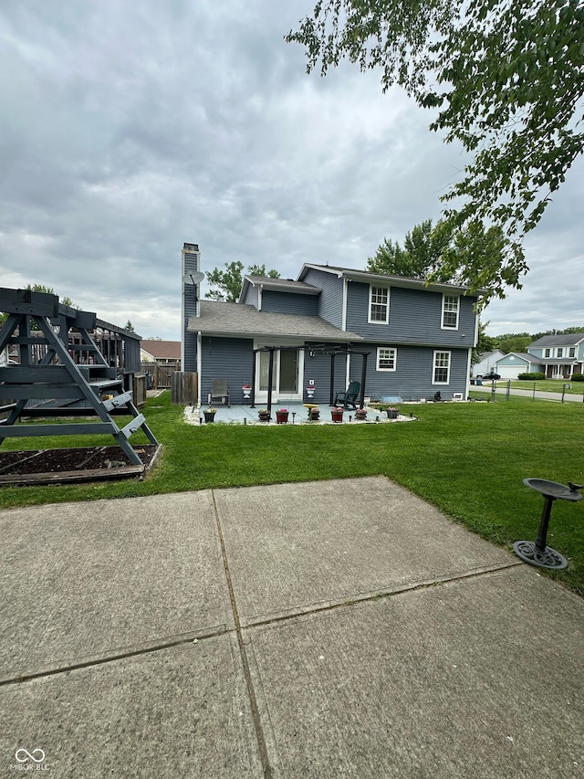 1831 Beckenbauer Ln, Indianapolis, IN 46214 - rear view of house with a patio and a chimney