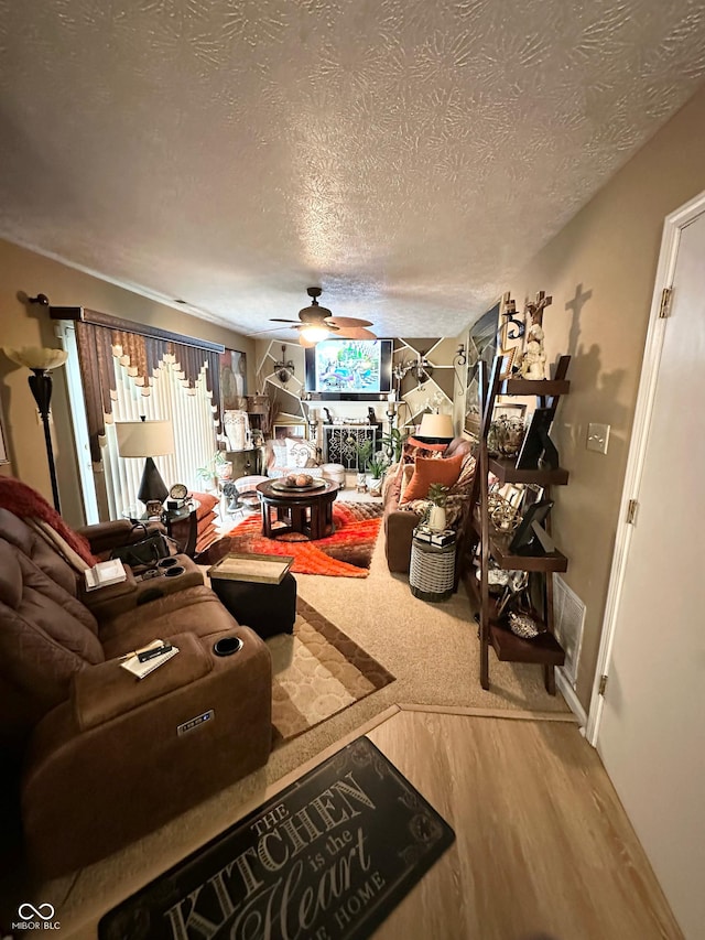 1831 Beckenbauer Ln, Indianapolis, IN 46214 - living room featuring a textured ceiling, wood finished floors, ceiling fan, and baseboards