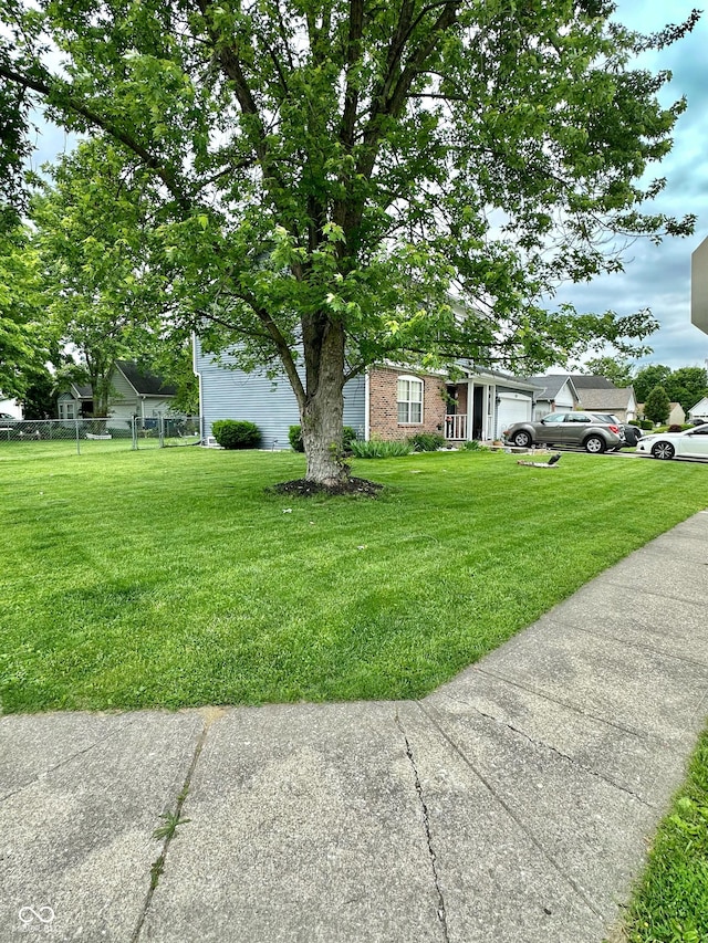 1831 Beckenbauer Ln, Indianapolis, IN 46214 - view of property exterior featuring brick siding and a garage