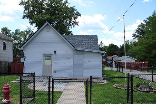 202 S Church St, Brooklyn, IN 46111 - back of property featuring roof with shingles and a gate