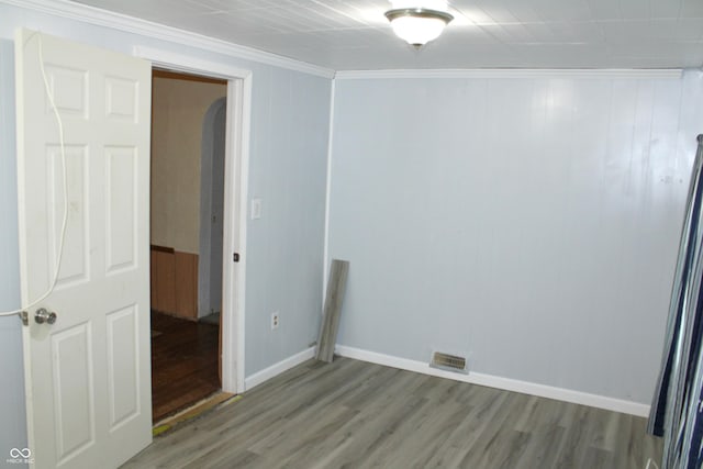 202 S Church St, Brooklyn, IN 46111 - spare room with arched walkways, wood finished floors, crown molding, and baseboards
