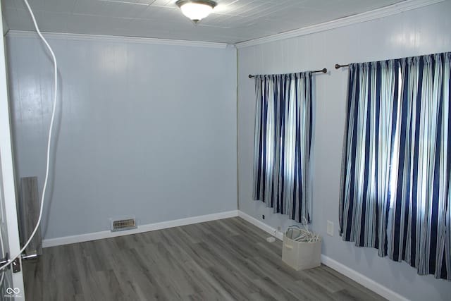 202 S Church St, Brooklyn, IN 46111 - spare room with crown molding, wood finished floors, and baseboards