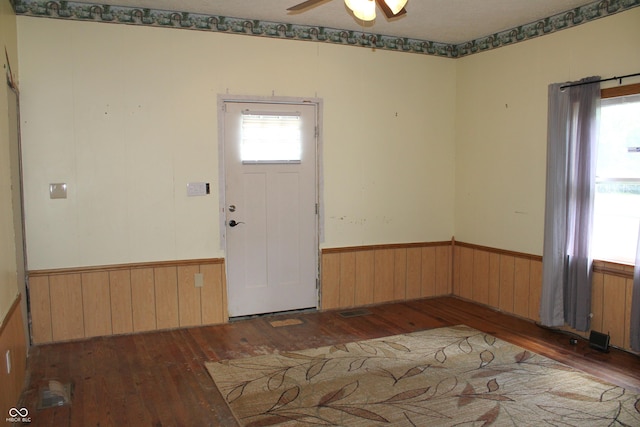 202 S Church St, Brooklyn, IN 46111 - entrance foyer with hardwood / wood-style floors, wainscoting, a ceiling fan, and wooden walls