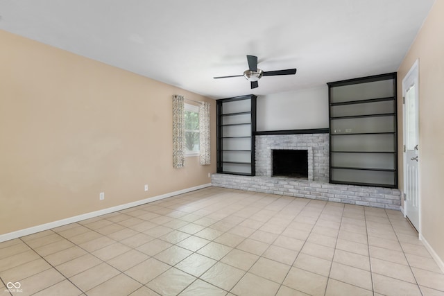 4904 N Tillotson Ave, Muncie, IN 47304 - unfurnished living room with ceiling fan, built in shelves, baseboards, a brick fireplace, and light tile patterned floors