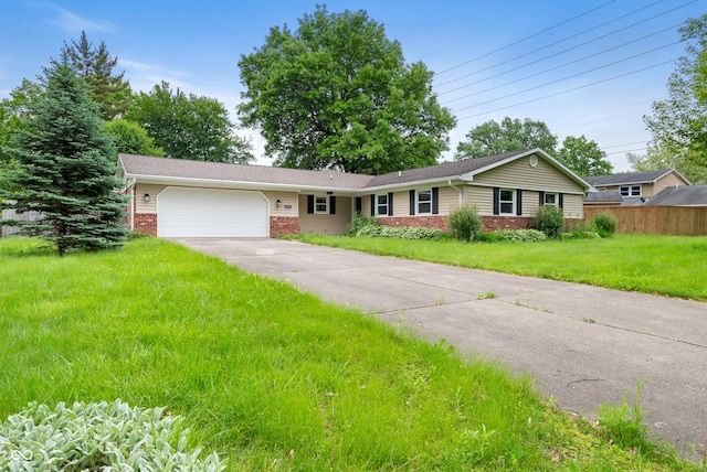 4904 N Tillotson Ave, Muncie, IN 47304 - ranch-style house featuring brick siding, an attached garage, and driveway