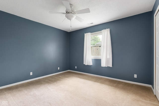 4904 N Tillotson Ave, Muncie, IN 47304 - carpeted empty room with baseboards, ceiling fan, and a textured ceiling