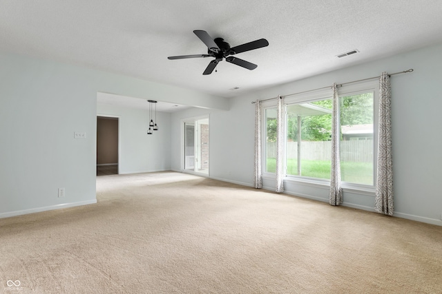 4904 N Tillotson Ave, Muncie, IN 47304 - unfurnished room with light carpet, a ceiling fan, and baseboards