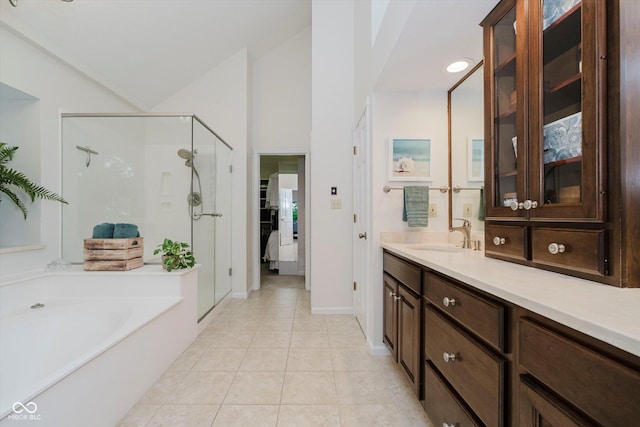 8301 Reef Ct, Indianapolis, IN 46236 - full bath with a stall shower, a bath, vanity, tile patterned floors, and lofted ceiling