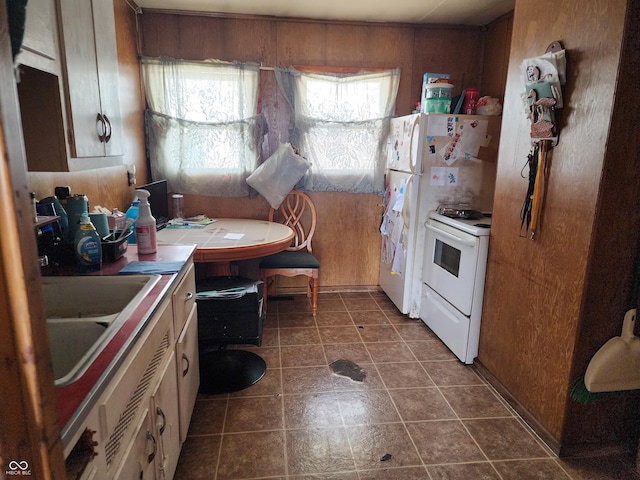 615 E 31st St, Anderson, IN 46016 - kitchen featuring white range with electric stovetop, tile counters, and a sink