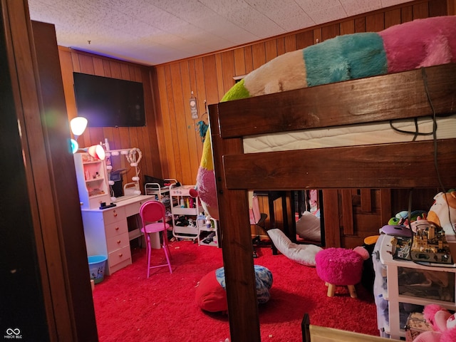 621 E 31st St, Anderson, IN 46016 - bedroom with carpet flooring, wooden walls, and a desk