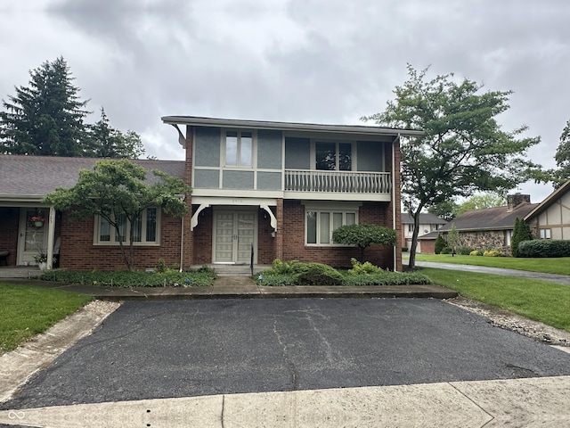 3975 Offshore Dr, Columbus, IN 47203 - view of front of property featuring brick siding, french doors, and a front yard