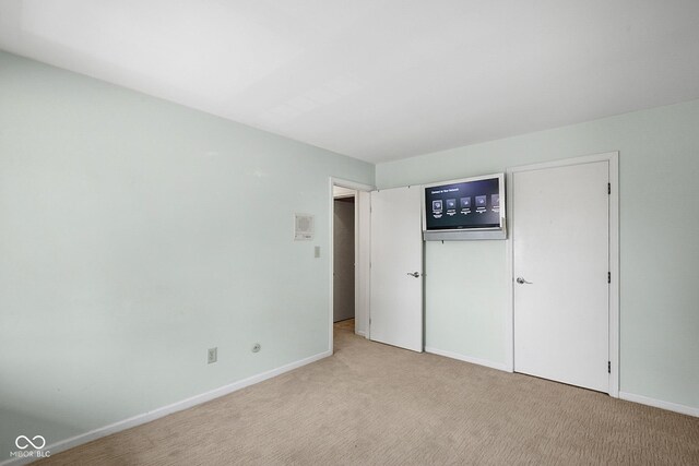 3975 Offshore Dr, Columbus, IN 47203 - unfurnished bedroom featuring light colored carpet and baseboards