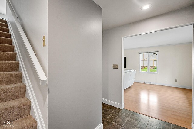 3975 Offshore Dr, Columbus, IN 47203 - staircase with baseboards, tile patterned floors, and recessed lighting