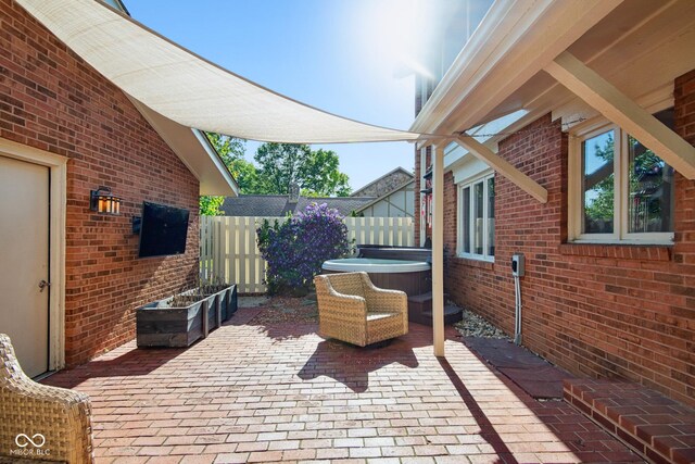 3975 Offshore Dr, Columbus, IN 47203 - view of patio / terrace featuring a hot tub