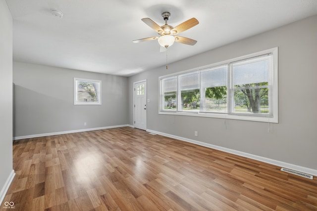 420 Vista Dr, Carmel, IN 46280 - spare room featuring light wood-style flooring, baseboards, and a ceiling fan