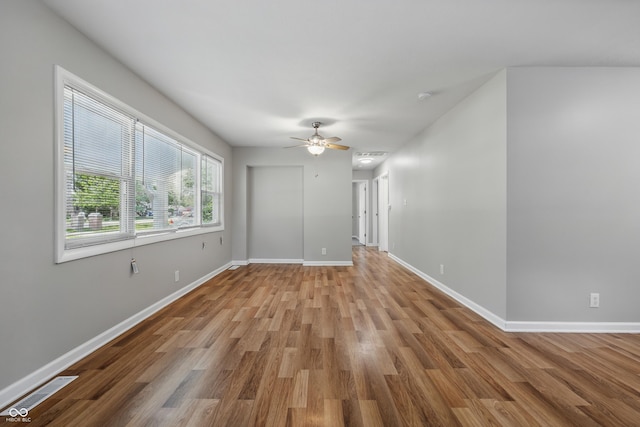 420 Vista Dr, Carmel, IN 46280 - empty room featuring wood finished floors, a ceiling fan, baseboards, and a smoke detector