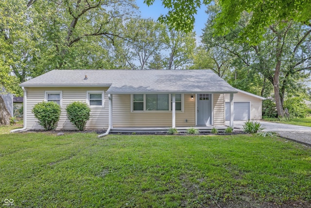 420 Vista Dr, Carmel, IN 46280 - view of front of home featuring a garage, driveway, a front yard, roof with shingles, and an outbuilding