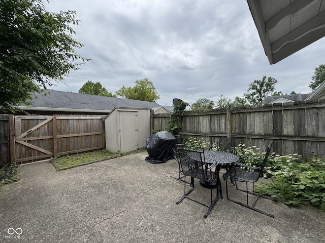 7445 Melanie Ln, Indianapolis, IN 46217 - fenced backyard featuring area for grilling and a patio