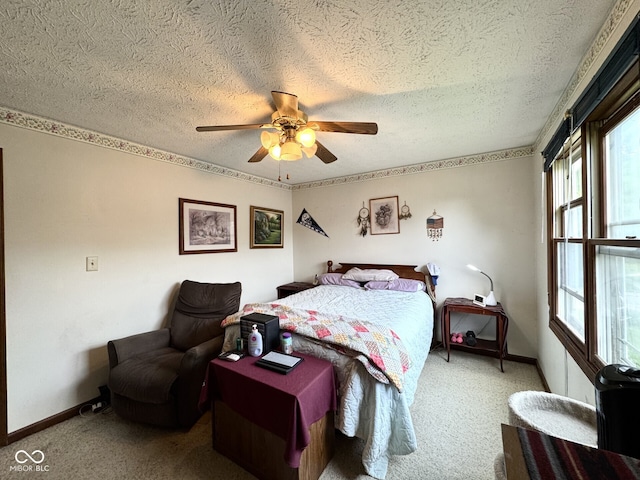 7445 Melanie Ln, Indianapolis, IN 46217 - carpeted bedroom featuring a textured ceiling, baseboards, and a ceiling fan