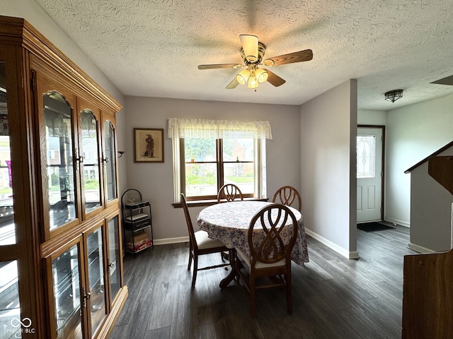 7445 Melanie Ln, Indianapolis, IN 46217 - dining space featuring baseboards, plenty of natural light, dark wood-style floors, and a textured ceiling