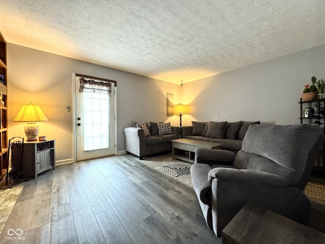7445 Melanie Ln, Indianapolis, IN 46217 - living room featuring wood finished floors and a textured ceiling