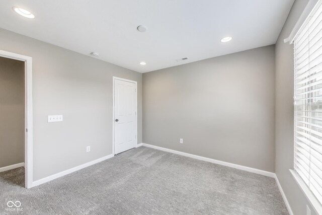 13050 Grand Vue Dr, Carmel, IN 46032 - carpeted empty room featuring baseboards, recessed lighting, and a smoke detector