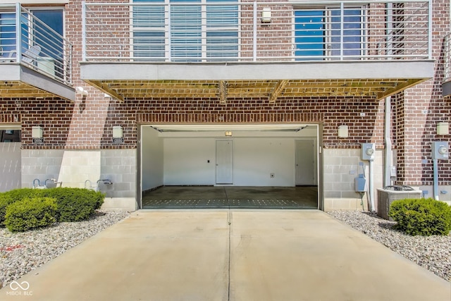 13050 Grand Vue Dr, Carmel, IN 46032 - garage featuring cooling unit and concrete driveway