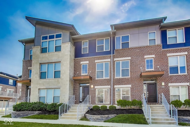 13050 Grand Vue Dr, Carmel, IN 46032 - townhome / multi-family property featuring brick siding