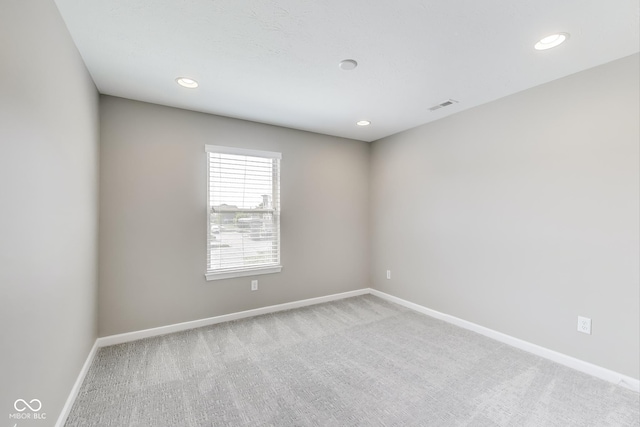 13050 Grand Vue Dr, Carmel, IN 46032 - empty room featuring light carpet, baseboards, and recessed lighting