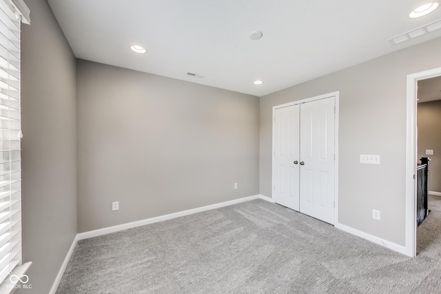 13050 Grand Vue Dr, Carmel, IN 46032 - unfurnished bedroom with carpet flooring, baseboards, recessed lighting, and a closet