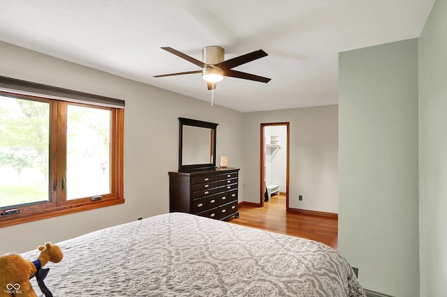1850 Longest Dr, Franklin, IN 46131 - bedroom featuring wood finished floors, a spacious closet, a ceiling fan, baseboards, and a closet