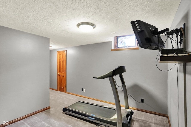 1850 Longest Dr, Franklin, IN 46131 - exercise room featuring a textured ceiling, baseboards, and carpet floors