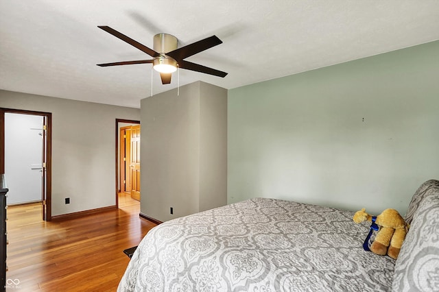 1850 Longest Dr, Franklin, IN 46131 - bedroom with wood finished floors, baseboards, and a ceiling fan