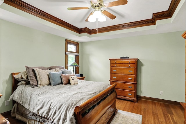 1850 Longest Dr, Franklin, IN 46131 - bedroom with a raised ceiling, ornamental molding, wood finished floors, baseboards, and a ceiling fan