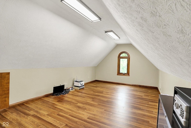 1850 Longest Dr, Franklin, IN 46131 - bonus room with a textured ceiling, vaulted ceiling, wood finished floors, and baseboards