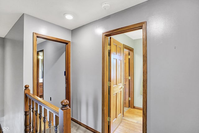 1850 Longest Dr, Franklin, IN 46131 - corridor with an upstairs landing, baseboards, and light wood-style flooring