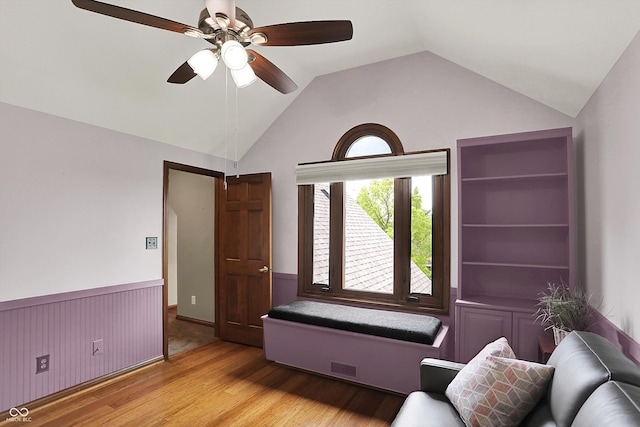 1850 Longest Dr, Franklin, IN 46131 - sitting room featuring wood finished floors, wainscoting, ceiling fan, and lofted ceiling