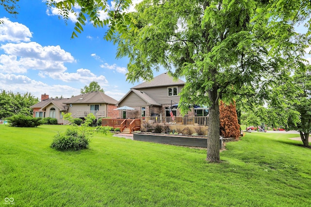 1850 Longest Dr, Franklin, IN 46131 - rear view of house featuring a yard, a wooden deck, and brick siding