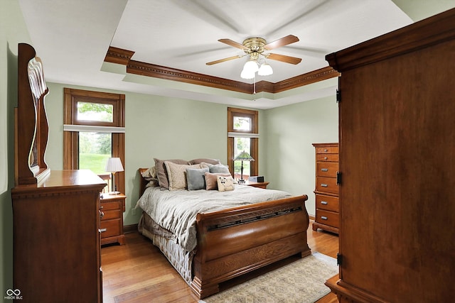 1850 Longest Dr, Franklin, IN 46131 - bedroom featuring a tray ceiling, light wood-type flooring, ornamental molding, and ceiling fan