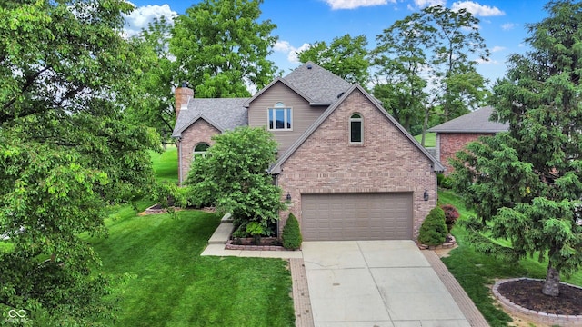 1850 Longest Dr, Franklin, IN 46131 - traditional-style home featuring brick siding, a chimney, concrete driveway, a front lawn, and a shingled roof