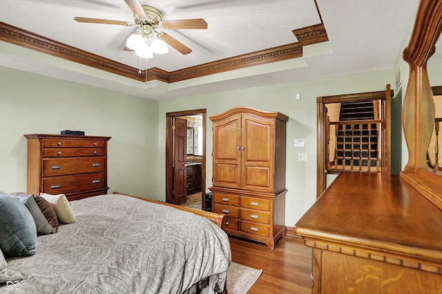 1850 Longest Dr, Franklin, IN 46131 - bedroom with a tray ceiling, wood finished floors, crown molding, ceiling fan, and ensuite bathroom