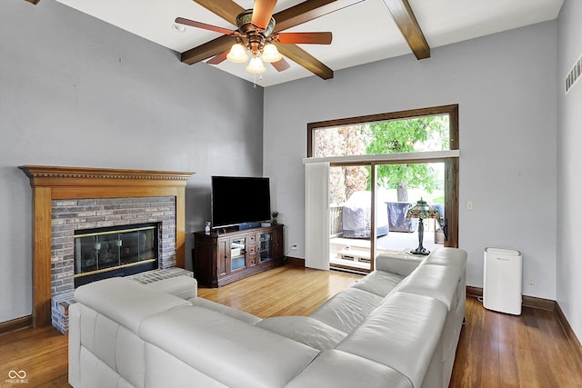 1850 Longest Dr, Franklin, IN 46131 - living area featuring wood finished floors, ceiling fan, beamed ceiling, baseboards, and a fireplace
