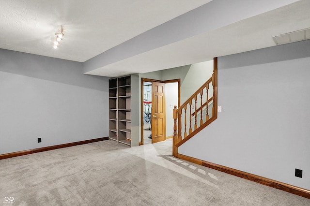 1850 Longest Dr, Franklin, IN 46131 - finished basement with baseboards, stairs, and carpet flooring