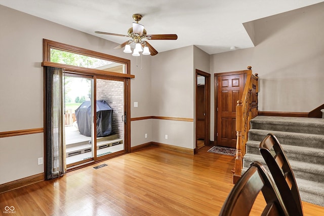 1850 Longest Dr, Franklin, IN 46131 - entryway with light wood finished floors, stairway, a ceiling fan, and baseboards