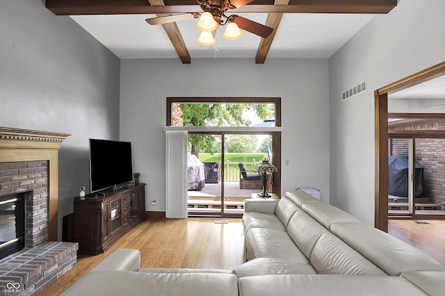 1850 Longest Dr, Franklin, IN 46131 - living room with a fireplace, wood finished floors, ceiling fan, and beam ceiling